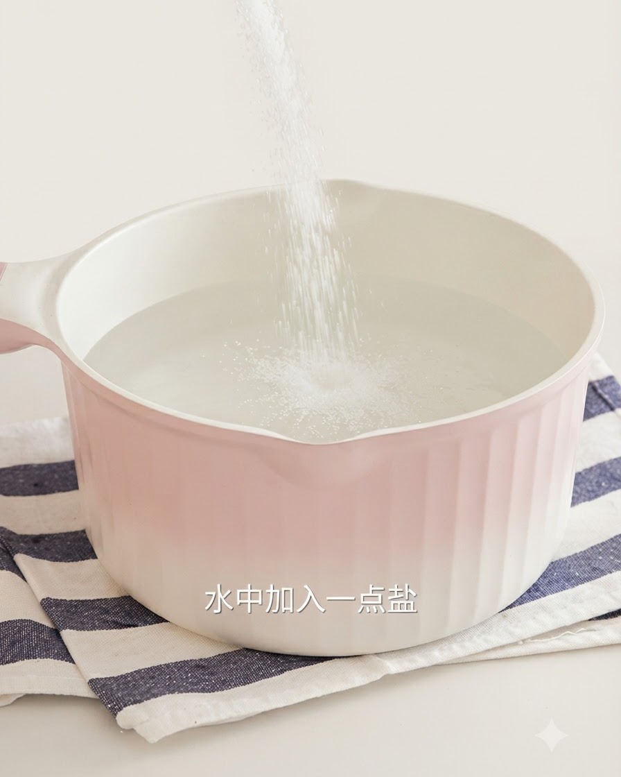 Salt being poured into a pink pot of boiling water for blanching basil.